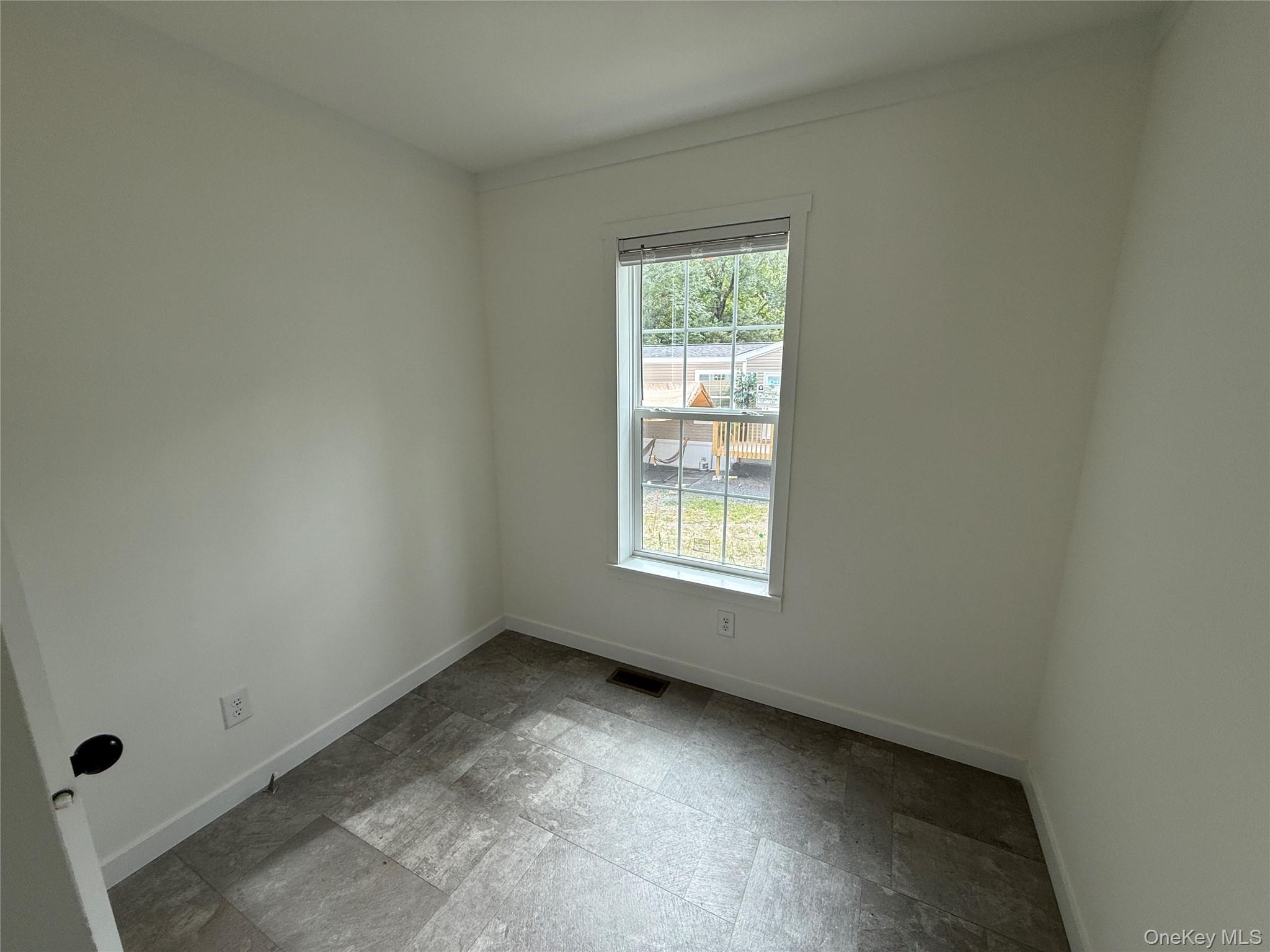 128 Forest Park Wallkill, NY 12589 - Photo 9 of 19 an empty room with a window