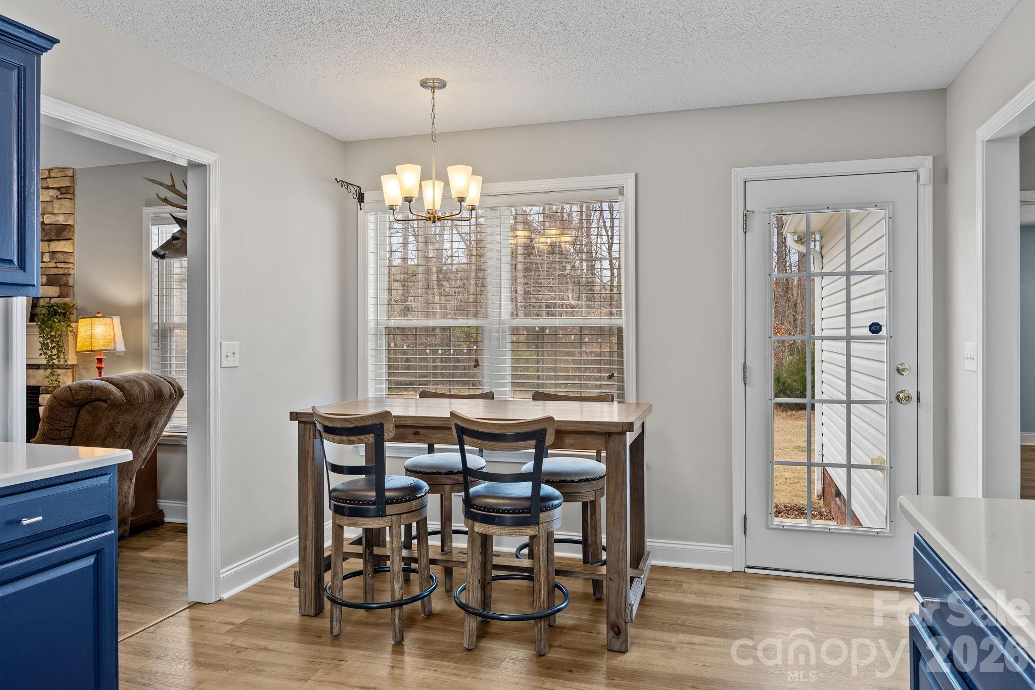 1749 Sells Road Salisbury, NC 28144 - Photo 13 of 47 a view of a dining room with furniture window and wooden floor