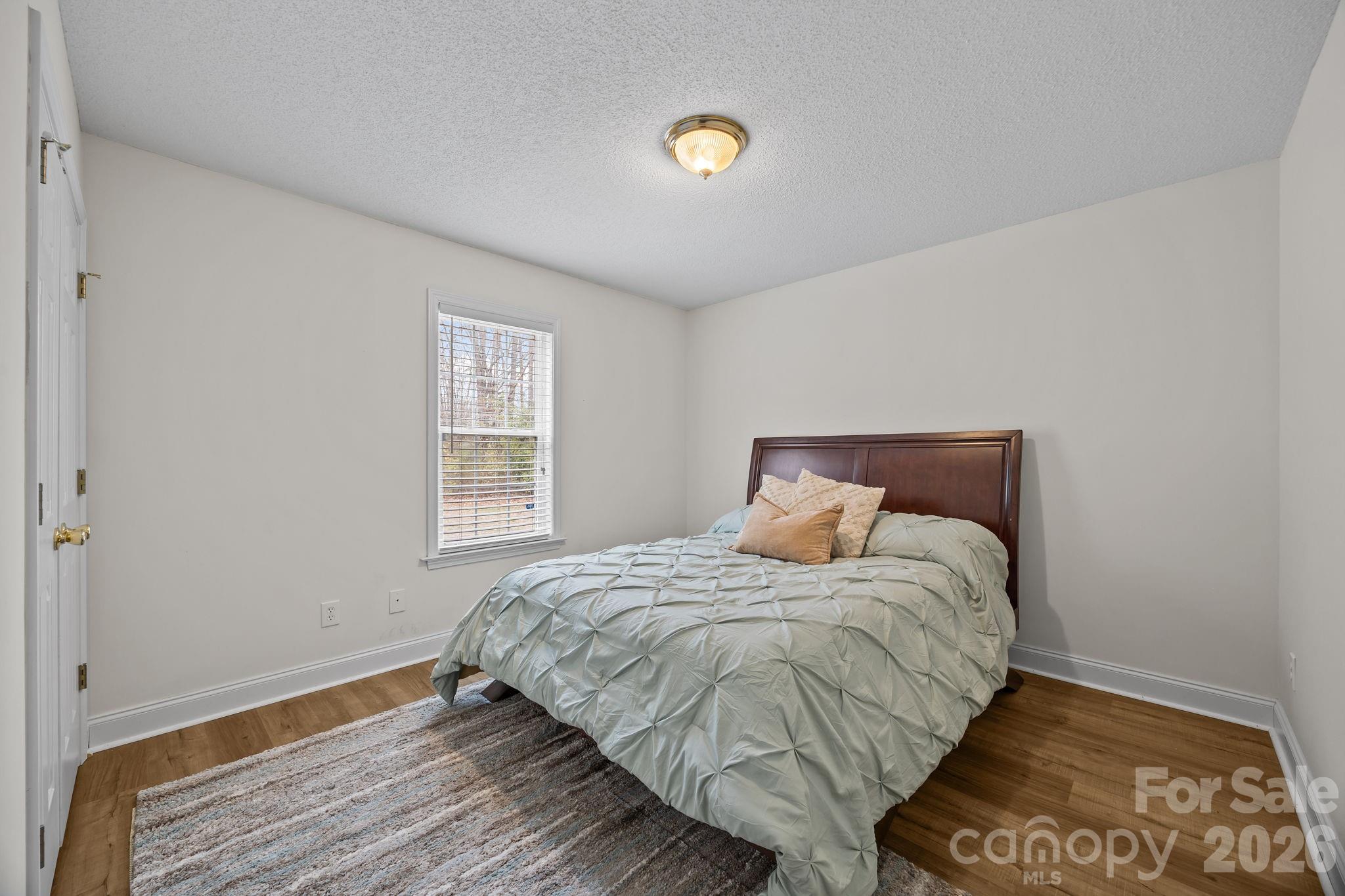 1749 Sells Road Salisbury, NC 28144 - Photo 23 of 47 a bedroom with a bed and a window