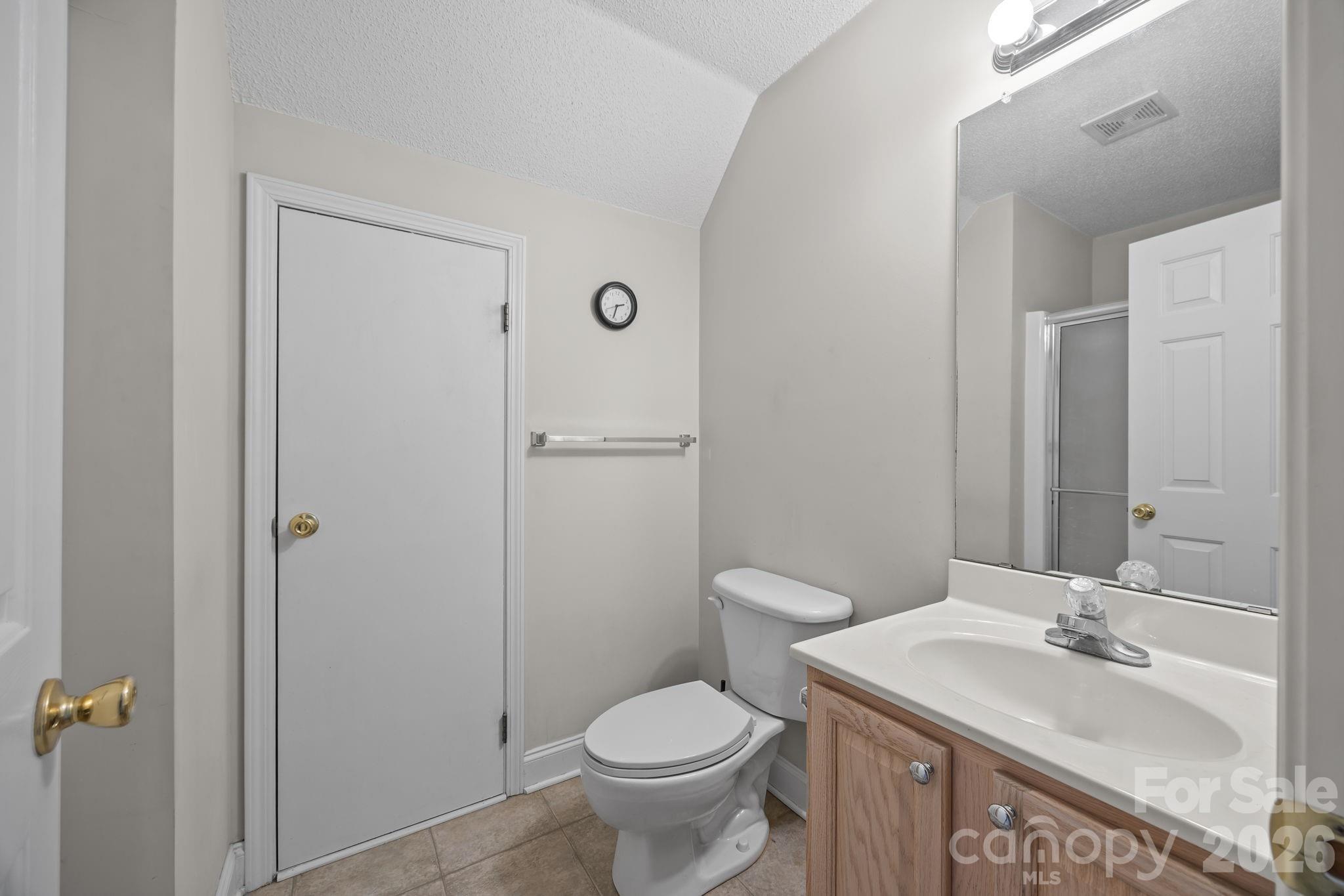1749 Sells Road Salisbury, NC 28144 - Photo 29 of 47 a bathroom with a granite countertop toilet sink and mirror