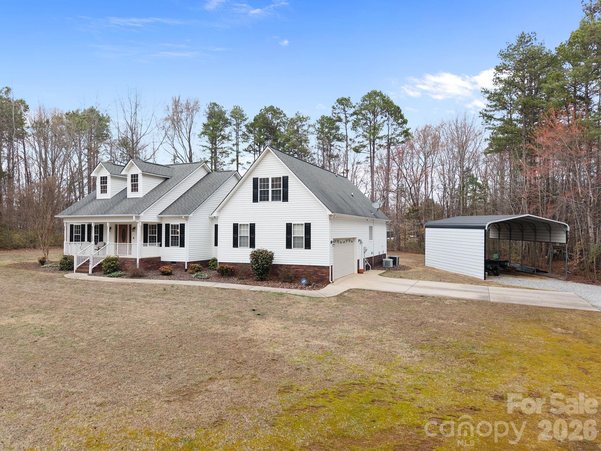 1749 Sells Road Salisbury, NC 28144 - Photo 4 of 47 a white house with a large tree in front of it