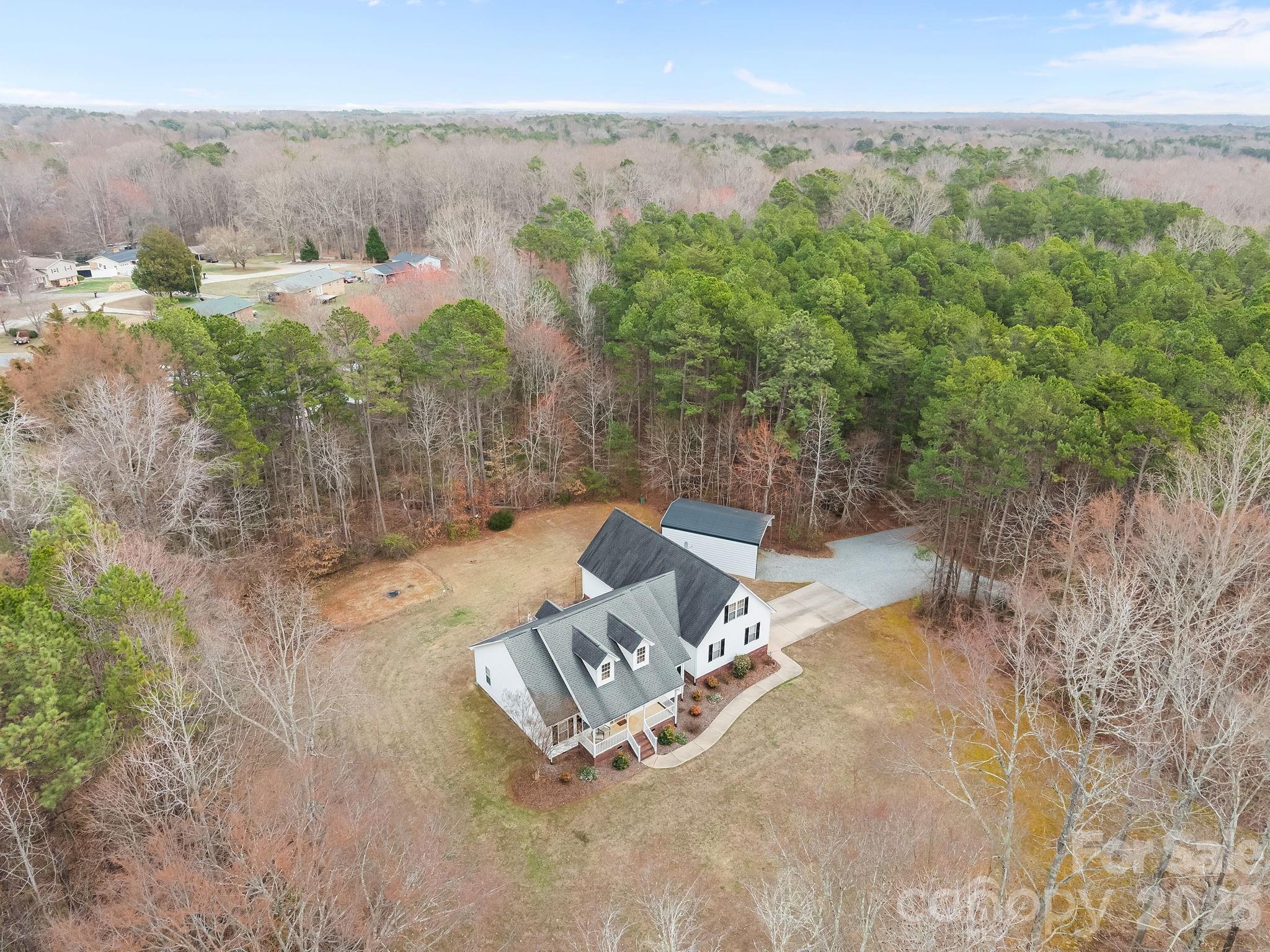1749 Sells Road Salisbury, NC 28144 - Photo 42 of 47 an aerial view of a house with yard and lake view