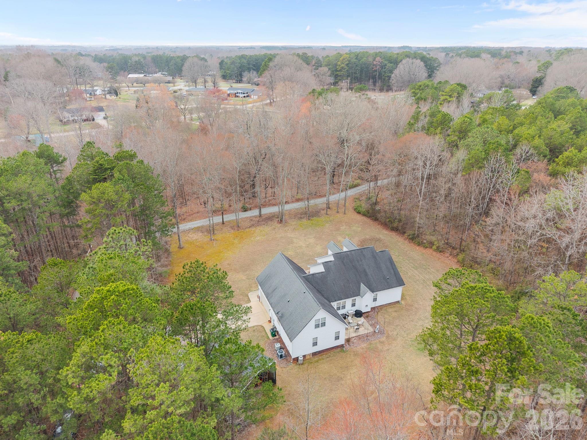 1749 Sells Road Salisbury, NC 28144 - Photo 43 of 47 an aerial view of a house with a yard and lake view