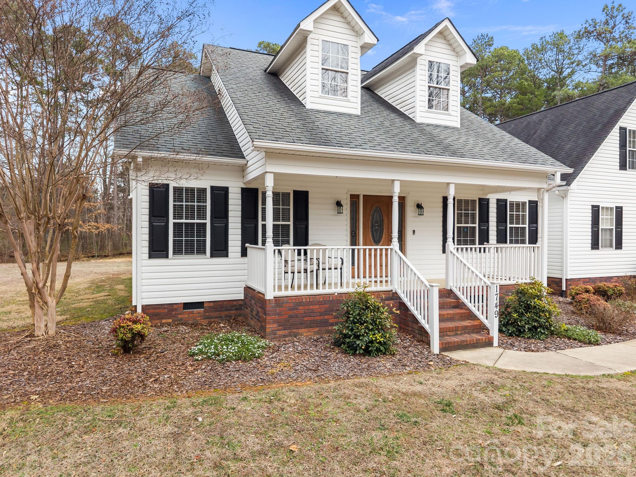 1749 Sells Road Salisbury, NC 28144 - Photo 5 of 47 a front view of a house with a yard