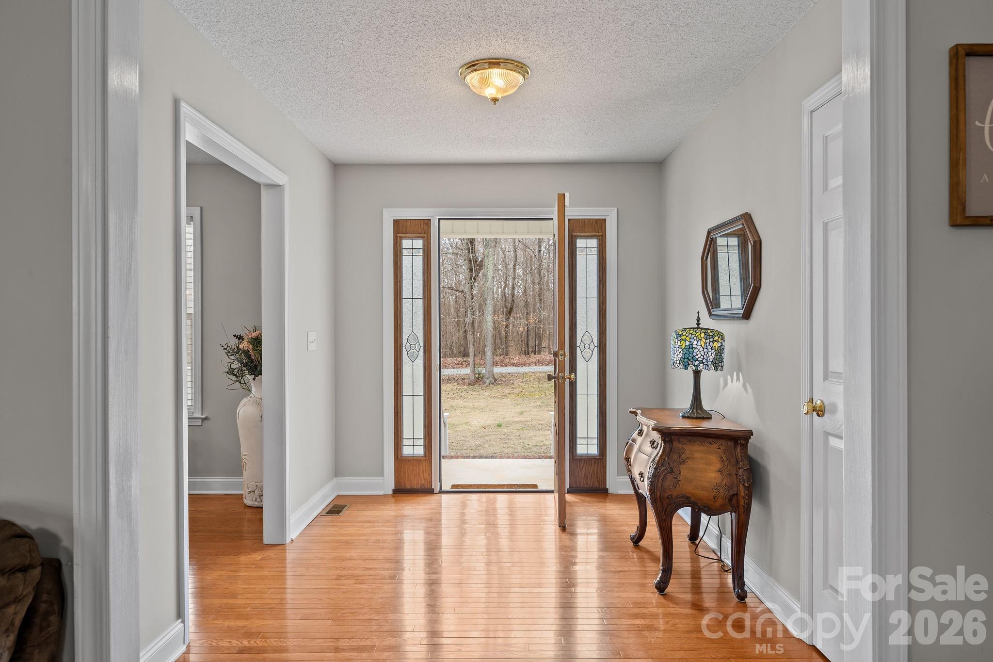1749 Sells Road Salisbury, NC 28144 - Photo 8 of 47 a bedroom with a bed and a painting on the wall