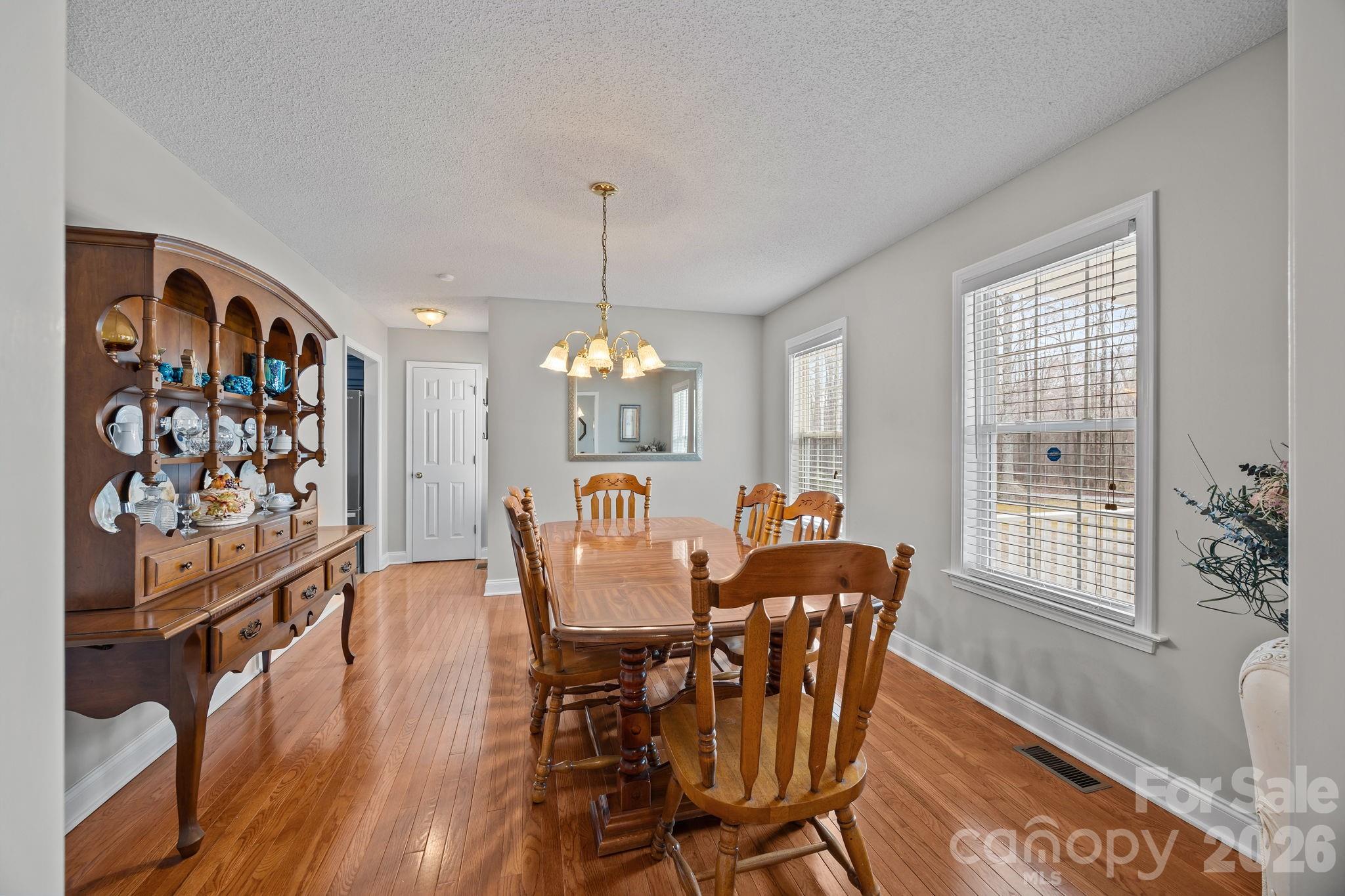 1749 Sells Road Salisbury, NC 28144 - Photo 9 of 47 a view of a dining room with furniture window and wooden floor