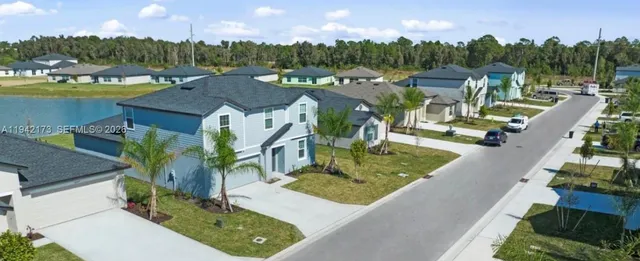 a view of a house with outdoor space and sitting area