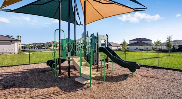 a view of a park with a slide
