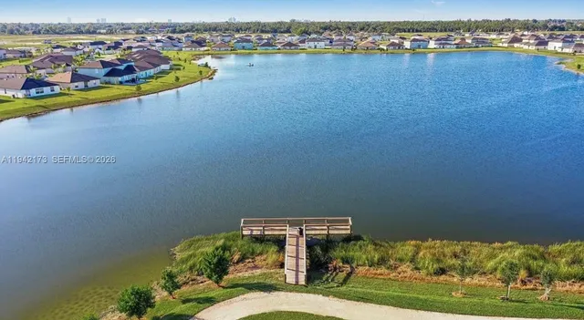 an aerial view of a house with a lake view