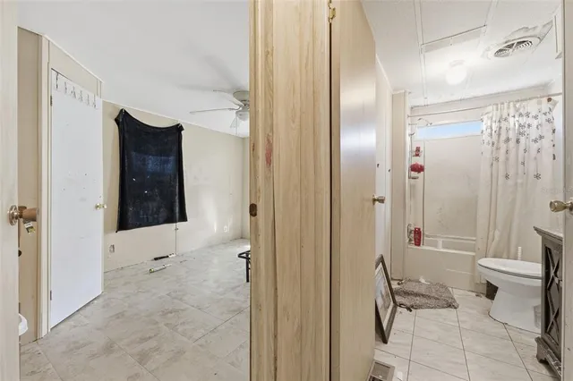 a view of a livingroom with a fireplace and cabinet