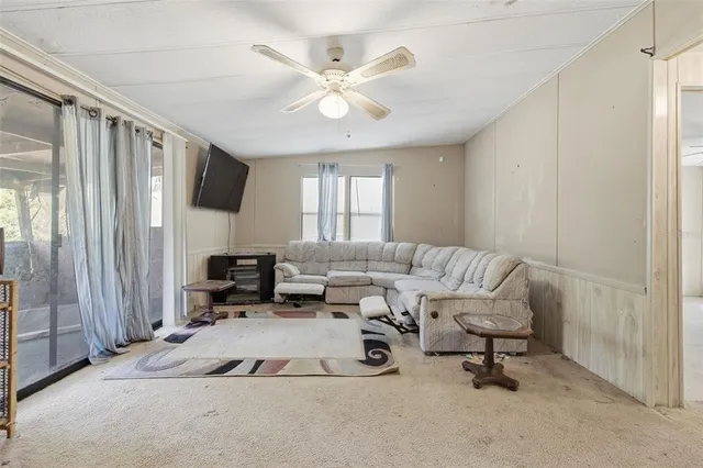 a view of a livingroom with a furniture and entryway