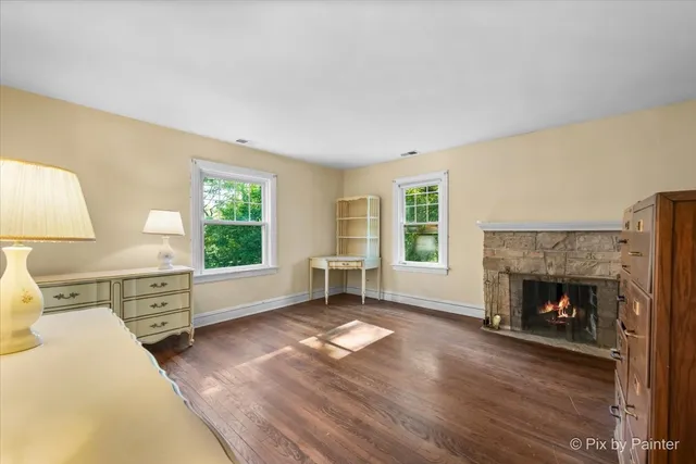 a view of empty room with a kitchen