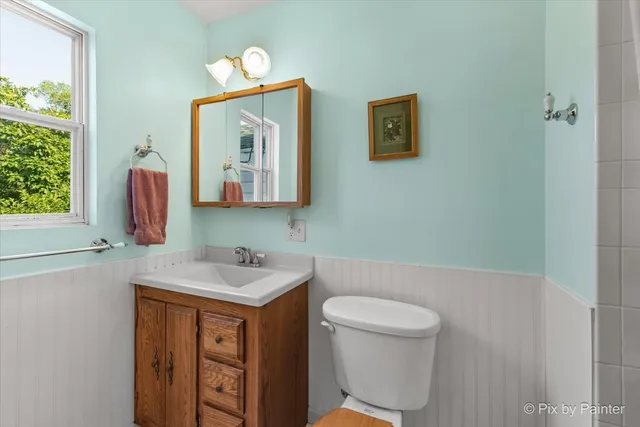 a dining room with furniture window wooden floor and garden view