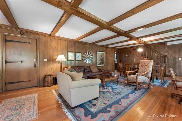 a bed room with a bed and a chandelier