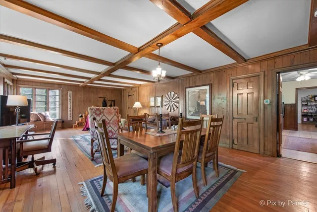 a view of a livingroom with workspace and a window