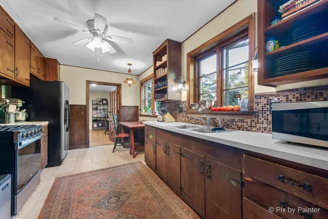 a bathroom with a sink and mirror with toilet