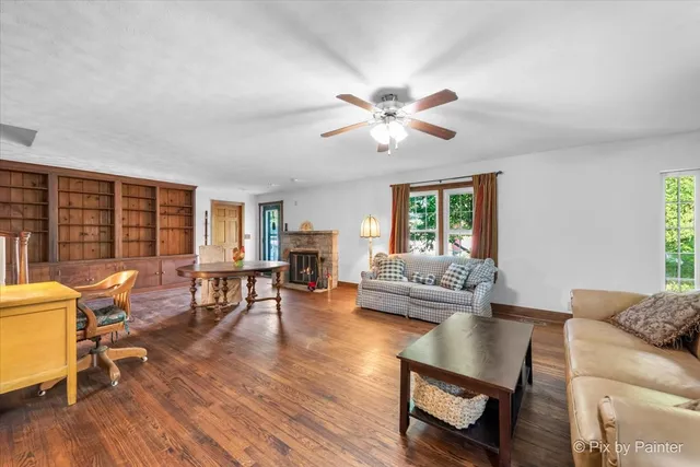 a living room with furniture and a fireplace