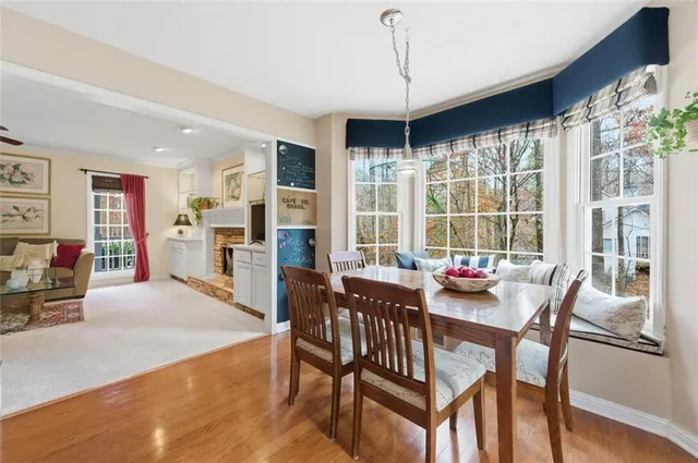 a view of a dining room with furniture window and wooden floor