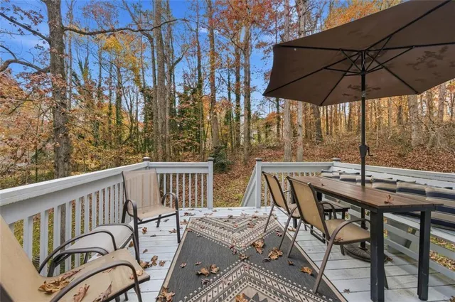 a view of a chairs and table in the balcony
