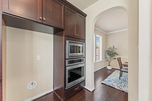 a kitchen with a refrigerator and cabinets