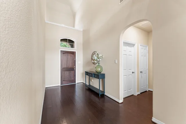 a view of an entryway with wooden floor