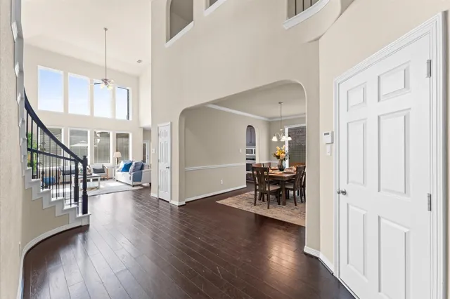 a view of a livingroom with furniture and hardwood floor