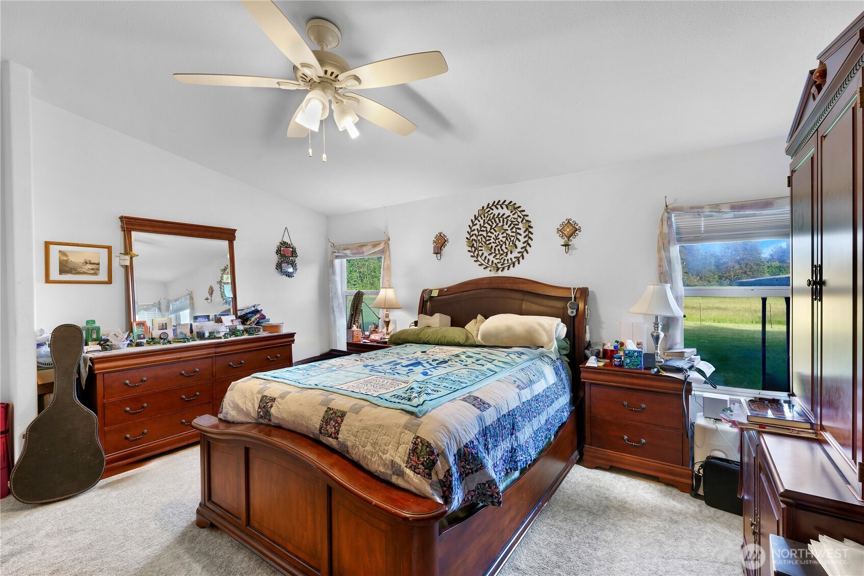 7928 Portal Way Custer, WA 98240 - Photo 24 of 39 a bedroom with a bed and a chandelier