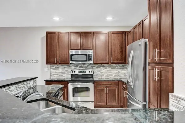 $475,000 | 4749 Grand Cypress Circle North, Coconut Creek, FL 33073