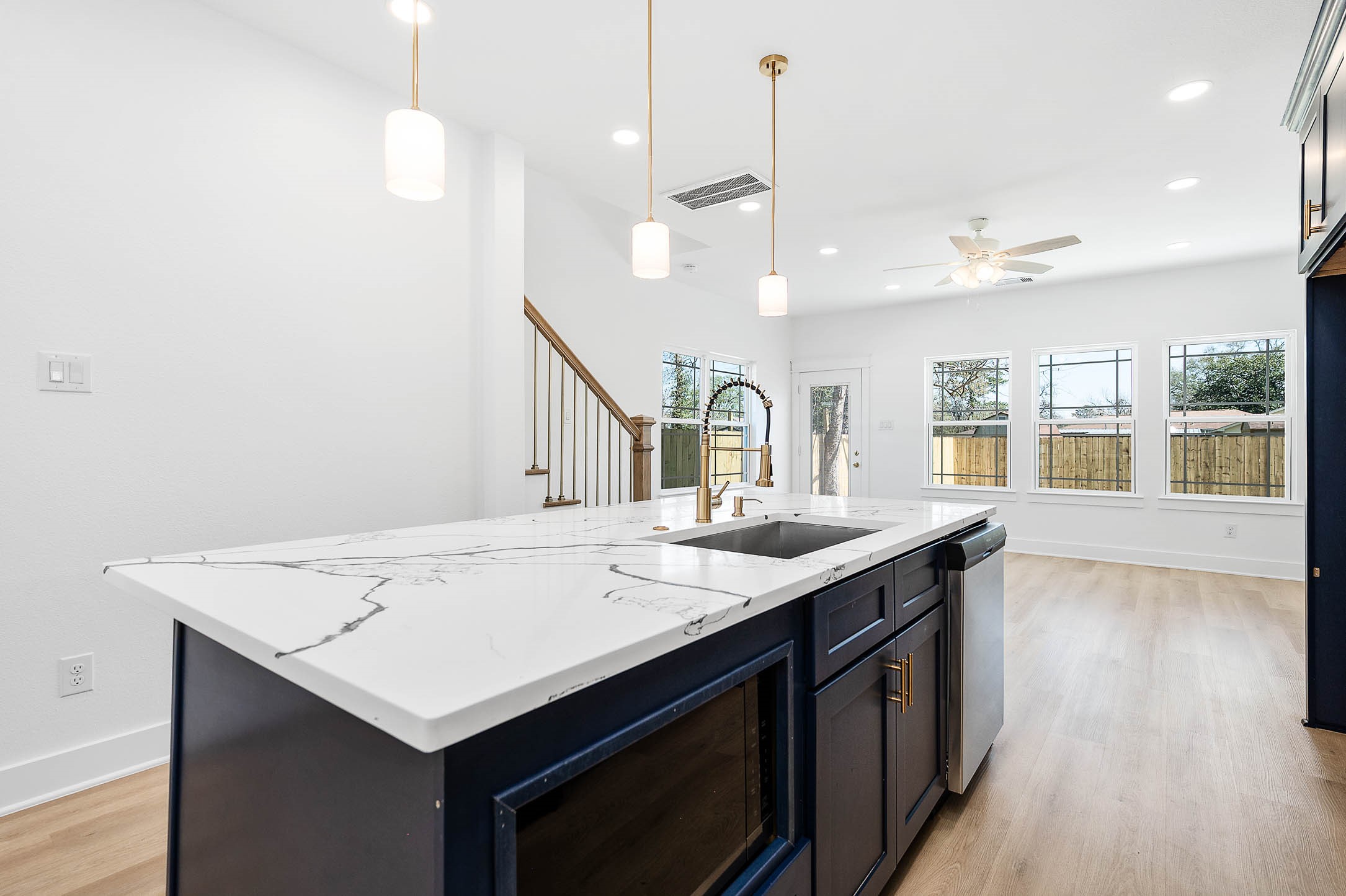 8602 Hoffman Street Houston, TX 77016 - Photo 10 of 30 Perspective view highlighting the quartz countertops and seamless flow into the bright living space.