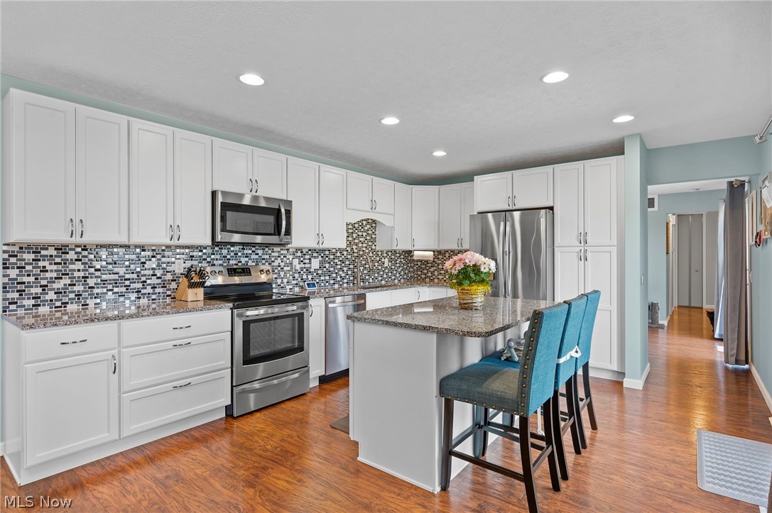 10806 Waterfall Road Strongsville, OH 44149 - Photo 10 of 38 The Kitchen has been remodeled with White Cabinets and Island...