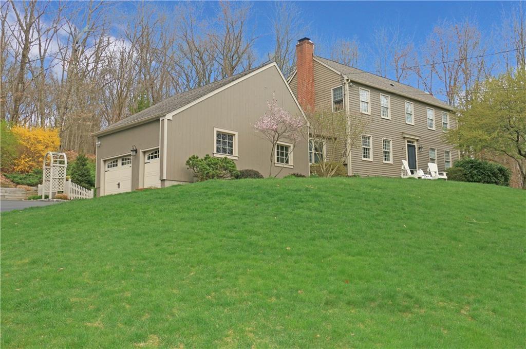 40 Huntingtown Road Newtown, CT 06470 - Photo 1 of 1 a view of a white house next to a yard with big trees