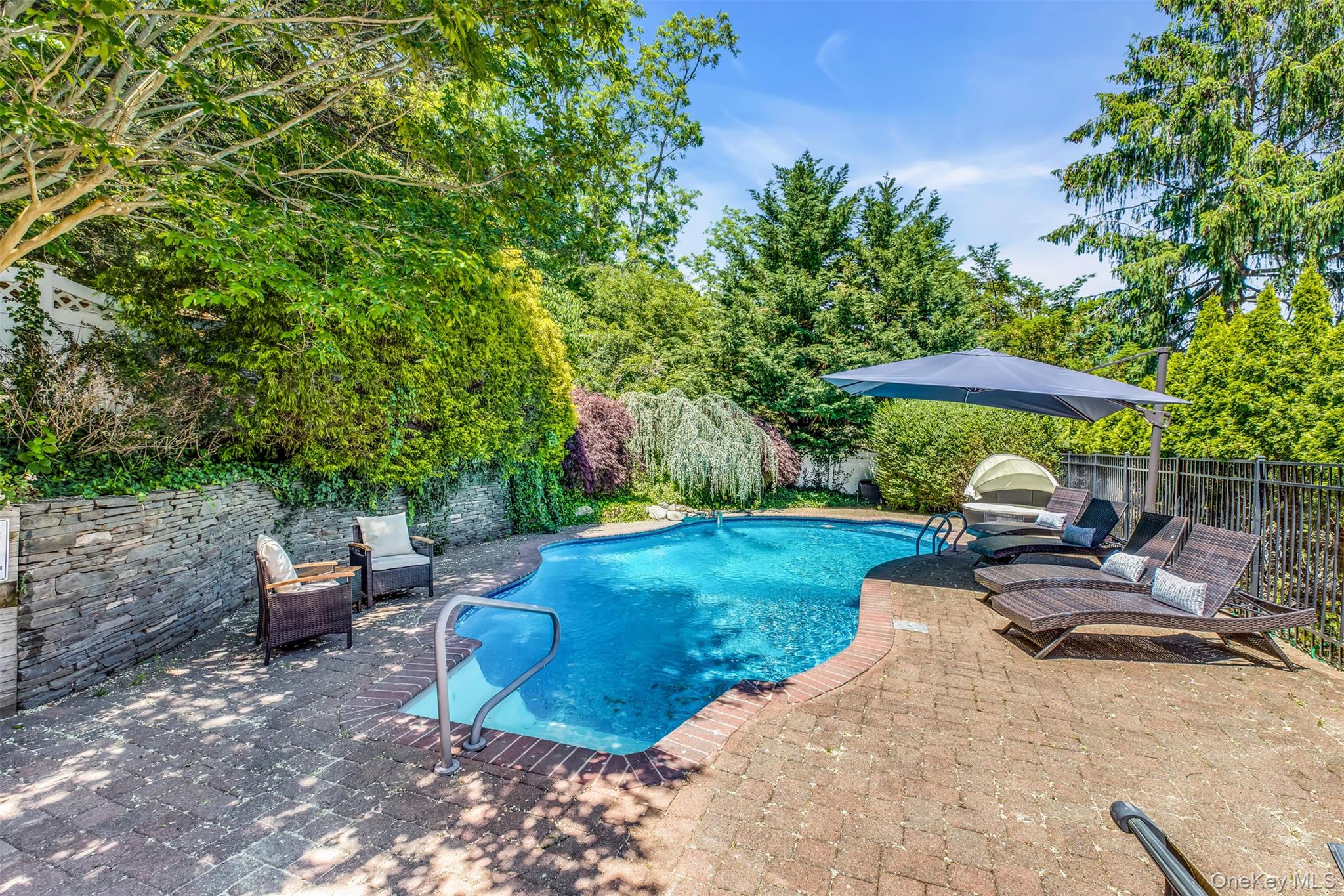 345 Colonial Road Southold, NY 11971 - Photo 33 of 43 a view of a backyard with sitting area