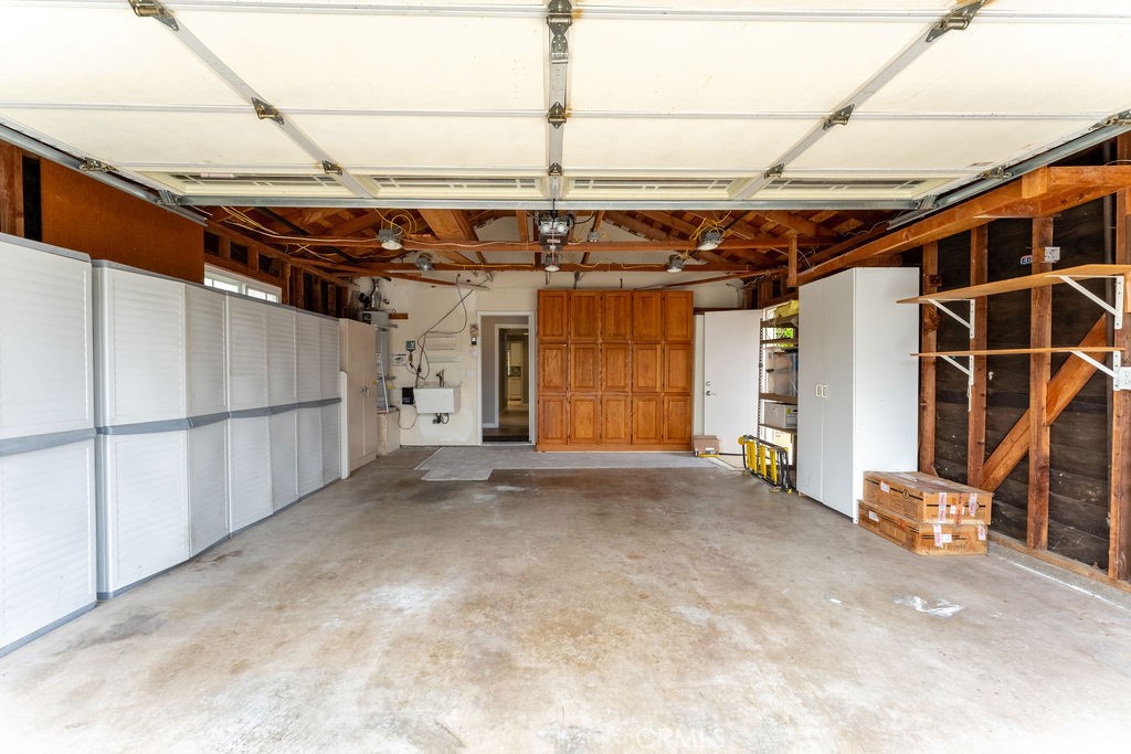 25352 Hugo Road Laguna Niguel, CA 92677 - Photo 26 of 31 Spacious 2 car garage with tons of storage cabinets. The handcrafted wooden cabinet were storage in the dining room.