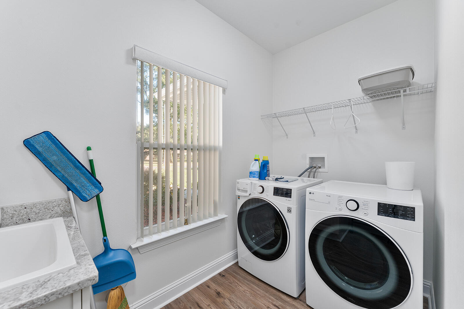 2944 Barton Road Crestview, FL 32539 - Photo 13 of 44 a view of storage and utility room with washer and dryer