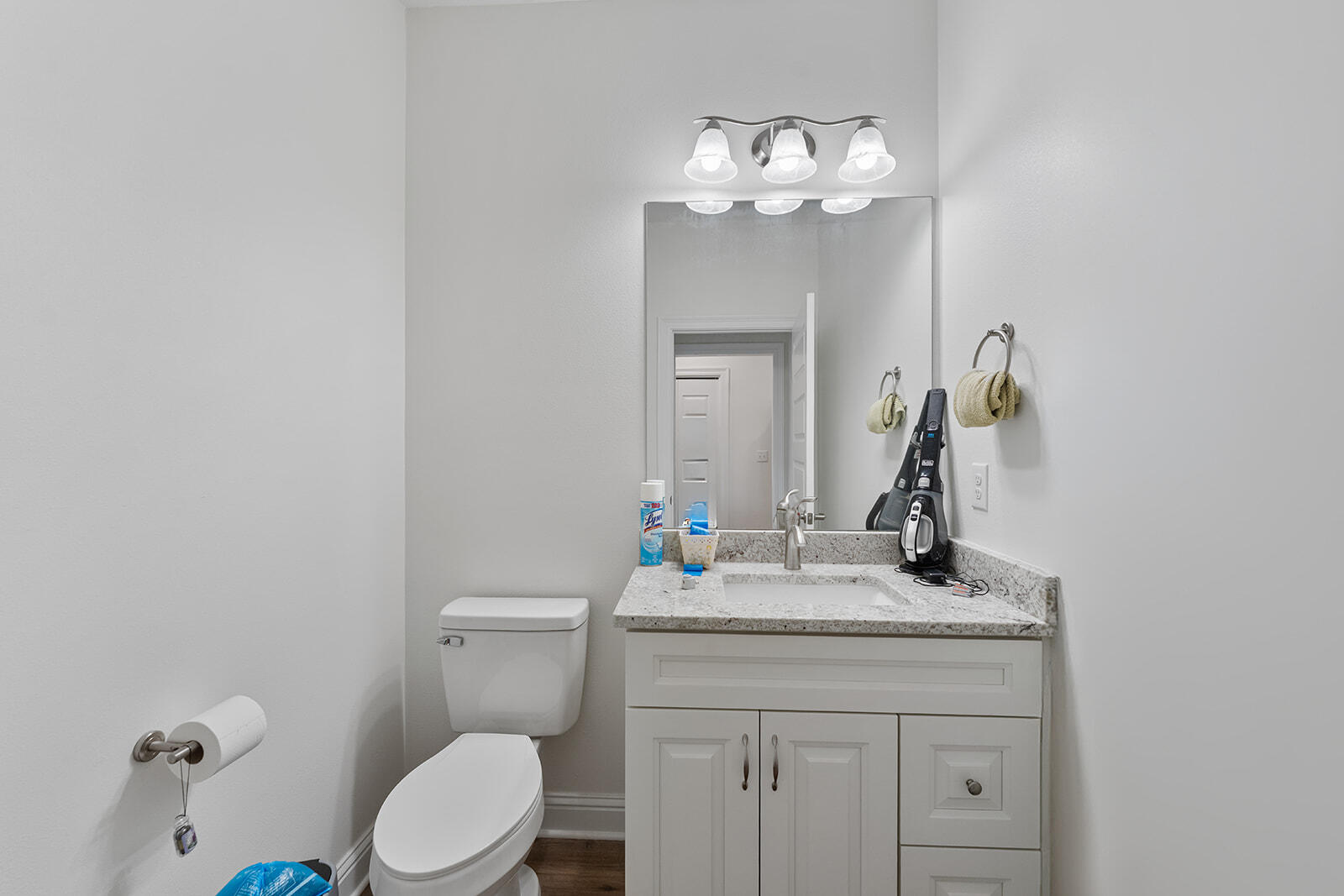 2944 Barton Road Crestview, FL 32539 - Photo 14 of 44 a bathroom with a sink vanity mirror and toilet