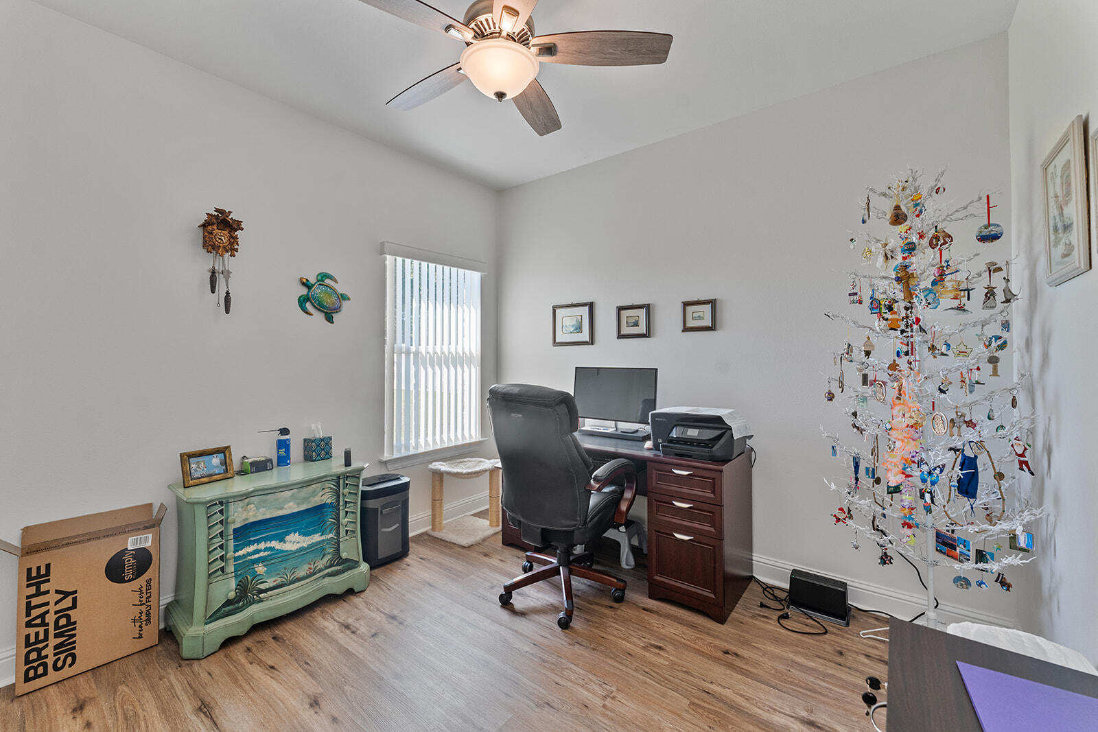 2944 Barton Road Crestview, FL 32539 - Photo 16 of 42 a view of a workspace with furniture and wooden floor