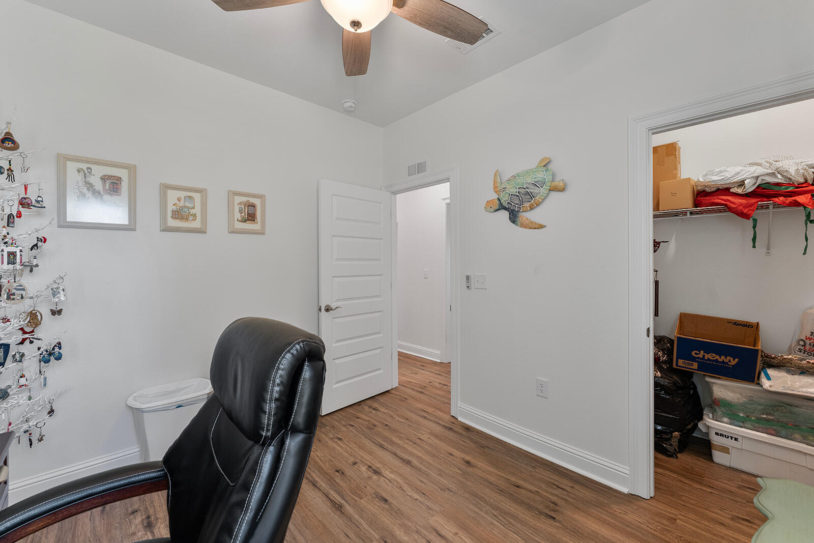 2944 Barton Road Crestview, FL 32539 - Photo 18 of 44 a view of a workspace with furniture and wooden floor