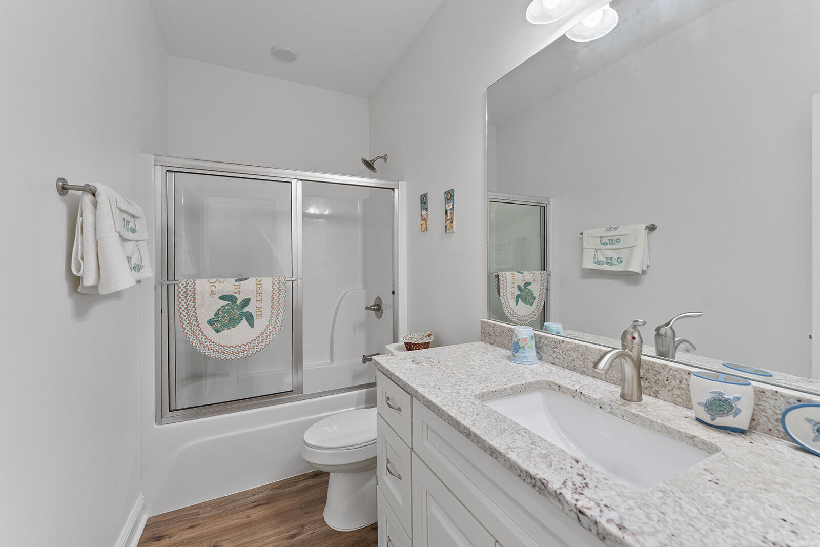2944 Barton Road Crestview, FL 32539 - Photo 18 of 42 a bathroom with a granite countertop toilet sink and mirror