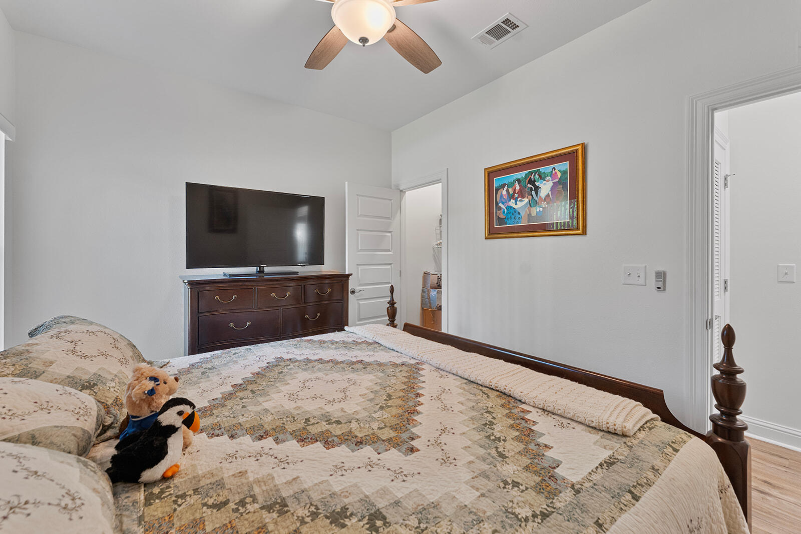 2944 Barton Road Crestview, FL 32539 - Photo 21 of 44 a bedroom with a bed and a flat screen tv