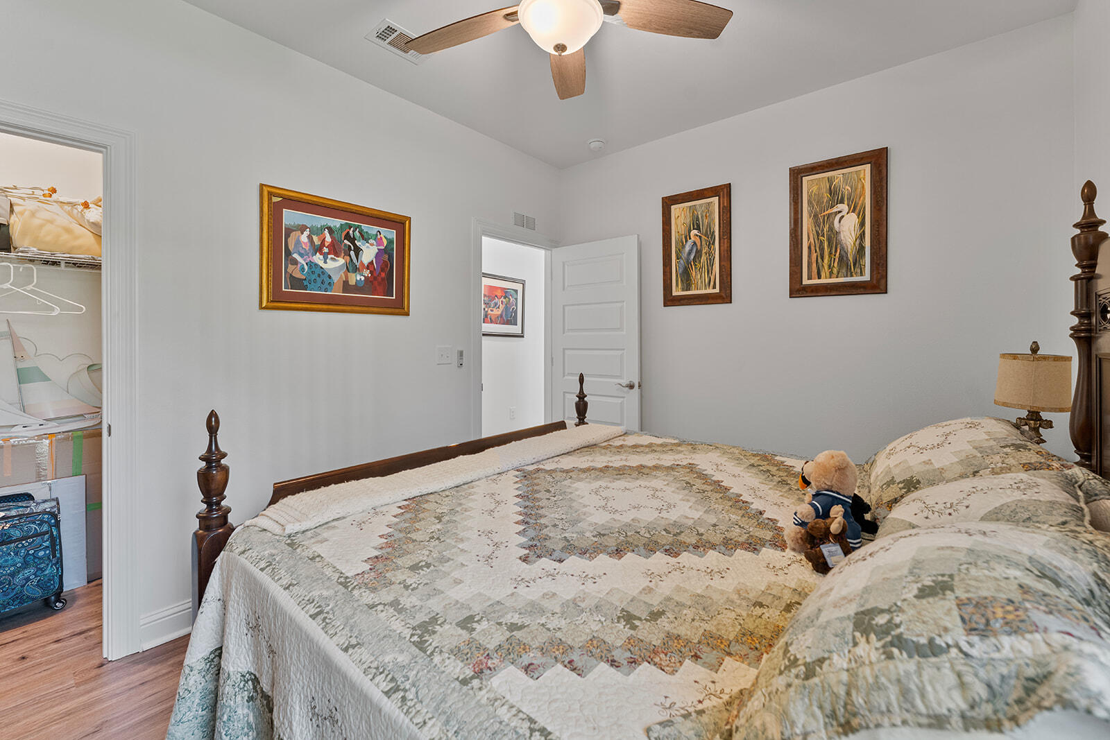 2944 Barton Road Crestview, FL 32539 - Photo 22 of 44 a bed sitting in a bedroom and painting on the wall