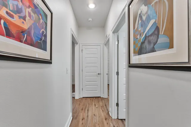 a view of front door with wooden floor