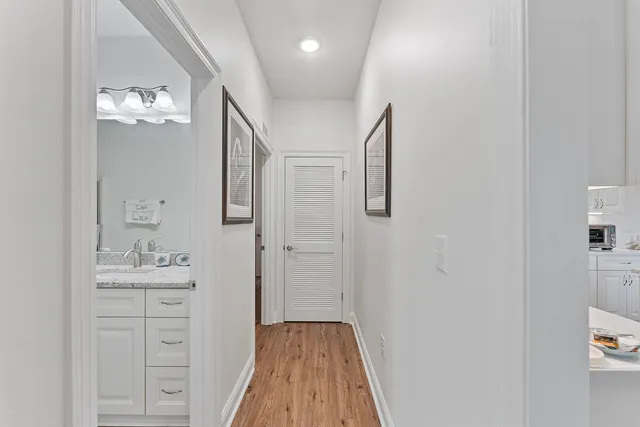 a bathroom with a sink mirror and a shower