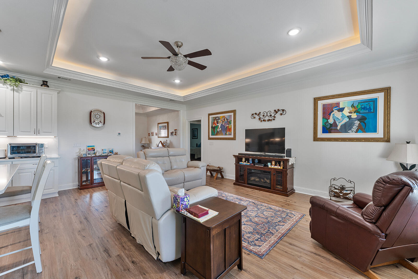 2944 Barton Road Crestview, FL 32539 - Photo 26 of 44 a living room with furniture and a flat screen tv with wooden floor