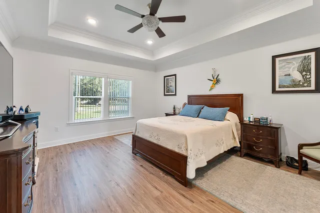 a view of a room with lots of stuff and hardwood floor