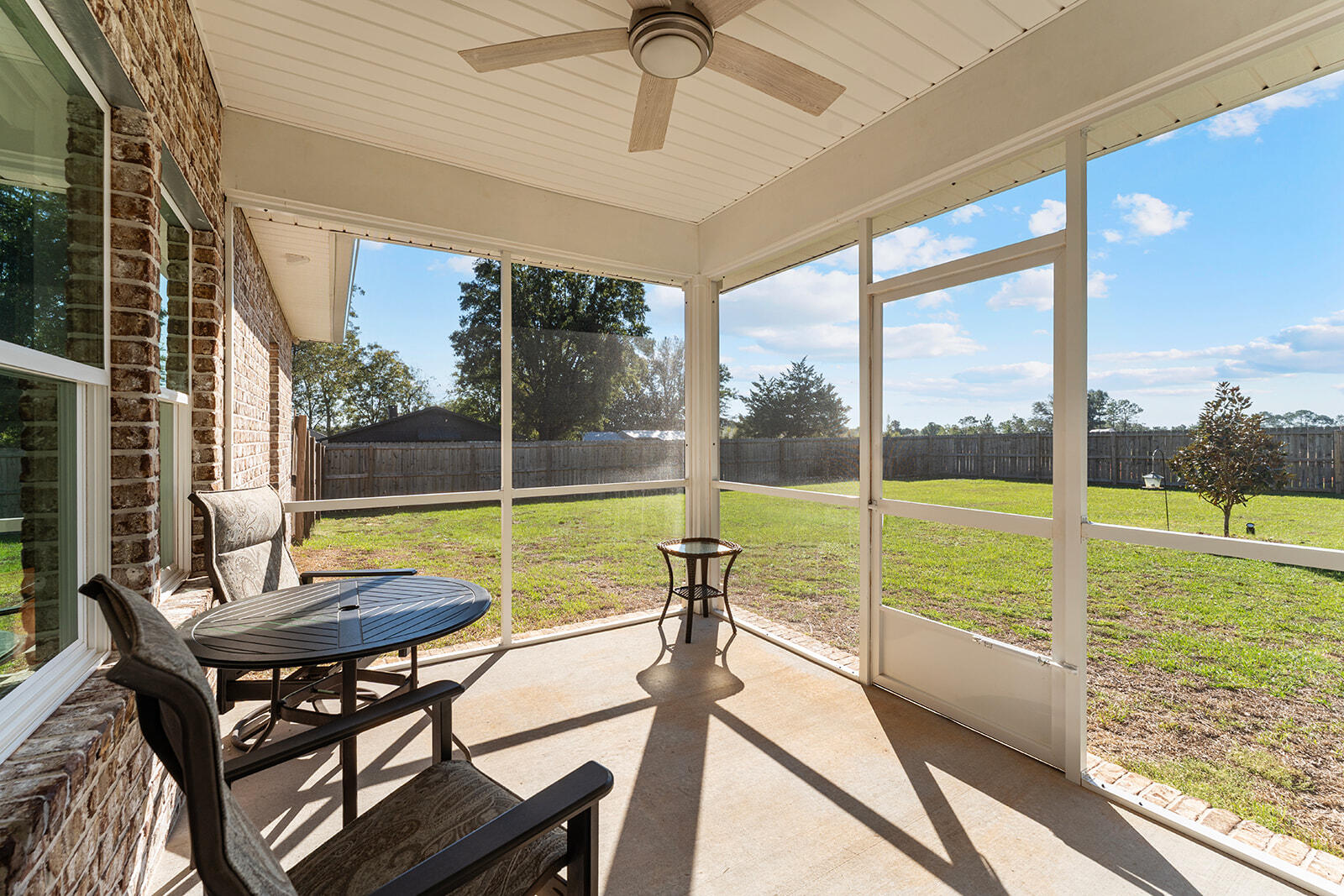 2944 Barton Road Crestview, FL 32539 - Photo 31 of 42 a view of a porch with furniture and a yard