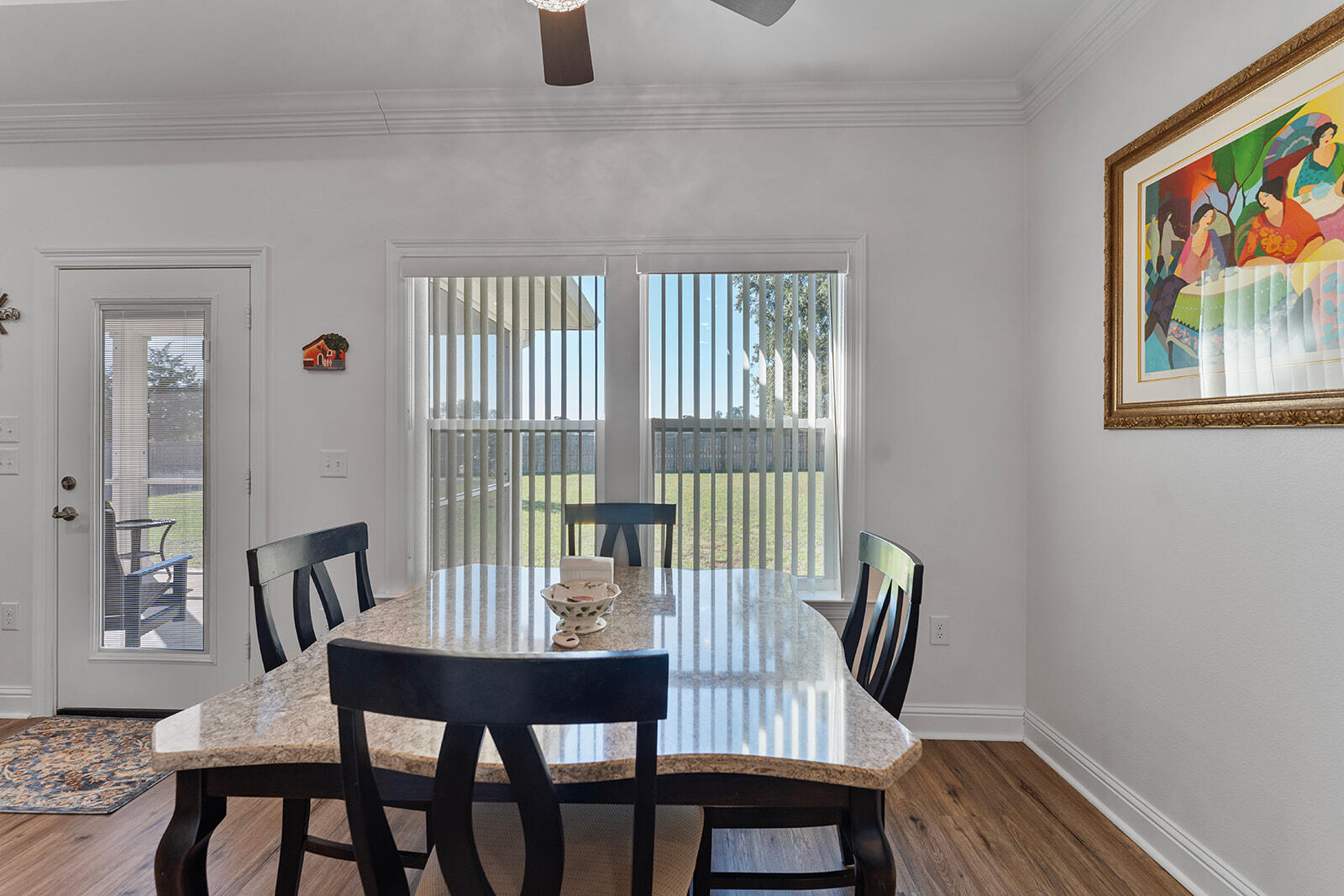 2944 Barton Road Crestview, FL 32539 - Photo 31 of 44 a view of a dining room with furniture and wooden floor