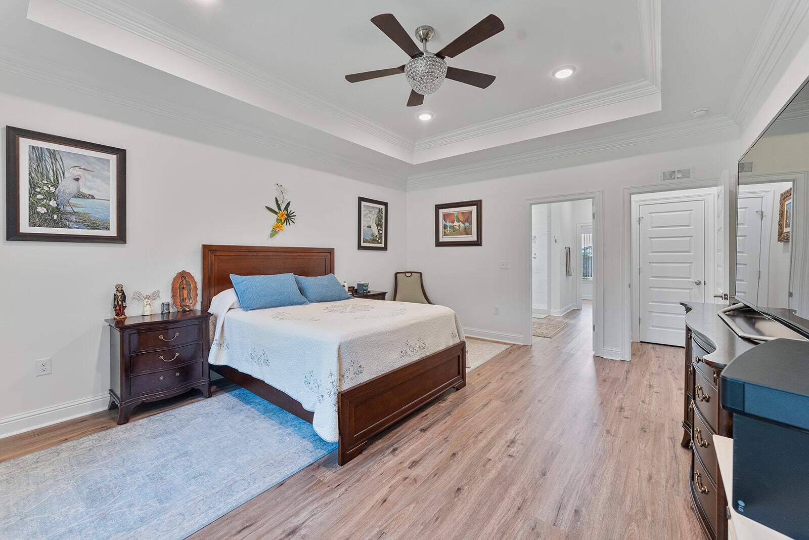 2944 Barton Road Crestview, FL 32539 - Photo 4 of 42 a spacious bedroom with a bed and a flat screen tv