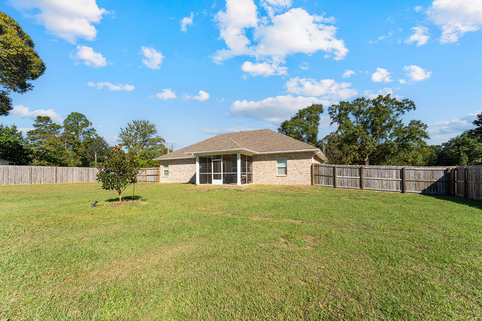 2944 Barton Road Crestview, FL 32539 - Photo 42 of 44 a house view with swimming pool and garden space