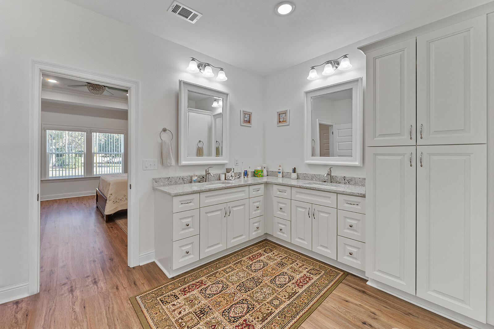 2944 Barton Road Crestview, FL 32539 - Photo 6 of 42 a spacious bathroom with a granite countertop sink and a mirror