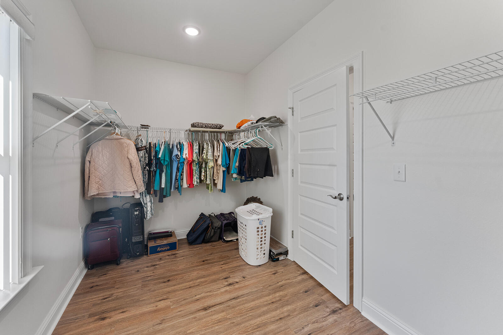 2944 Barton Road Crestview, FL 32539 - Photo 8 of 42 a view of walk in closet with clothes and shoes